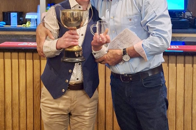 CLUBMAN OF THE YEAR: Dai Rees presents the award to Rhys James, who has been water boy for the team former than 20 years