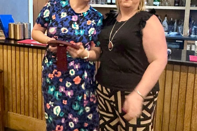 Nicole Bennett received the Tim Watkins Memorial Trophy from Jo Powell for her contribution to mini/junior rugby