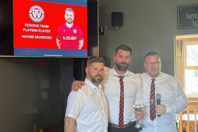 Mardy FC chairman Chris Price and reserve team manager James Woods with Reserve Team Players' Player Wayne Saunders