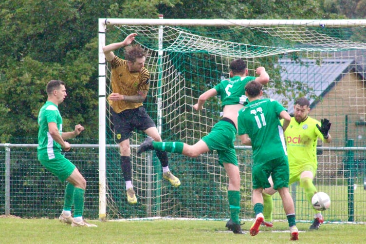 Matthew Knights rises to head Clydach Wasps in front in the Hay Challenge Cup final