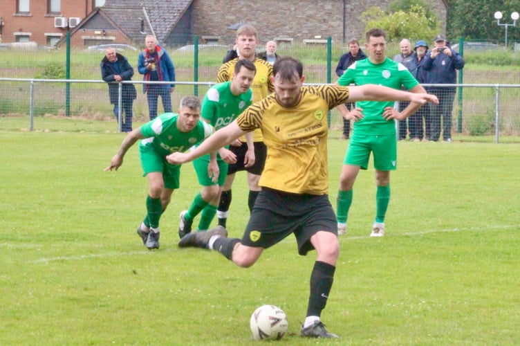 Clydach and Hay players battle for the ball