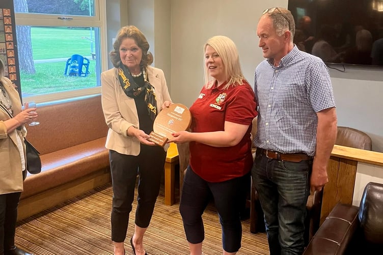 Bob Evans' daughter receives the plaque in honour of Abergavenny RFC's three Lions