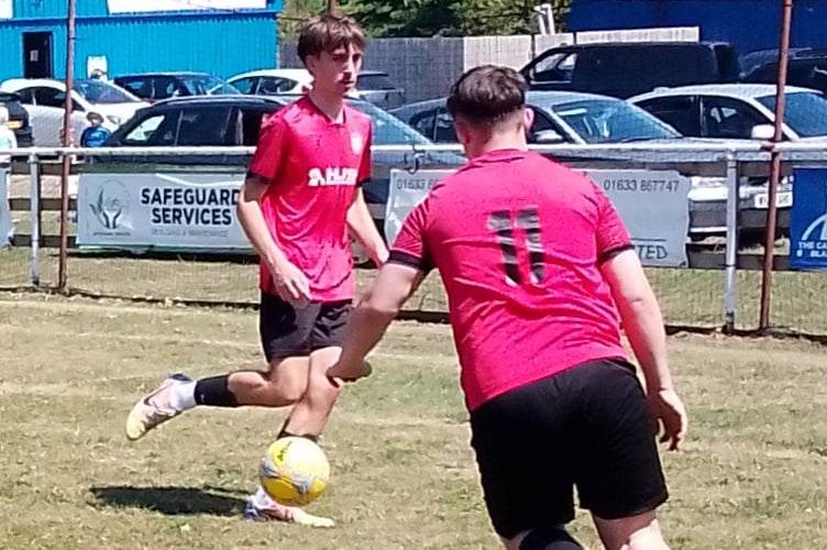 Dan Wait crosses watched by Charlie Morris