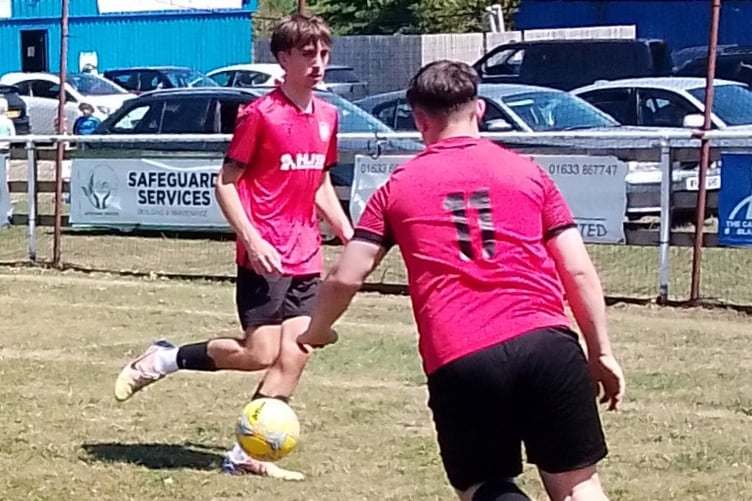 Dan Wait crosses watched by Charlie Morris