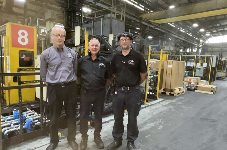 PICTURE CAPTION: CastAlum, in Welshpool, received a Business Growth Grant through Powys County Council last year worth £25,000, which it put towards the cost of updating two of its die-cast machines. With one of the machines they are bringing back into use are (from left): Karl Meredith, Managing Director; Simon Grimwade, Plant Manager; and Neil Simmonds, Maintenance Manager.

