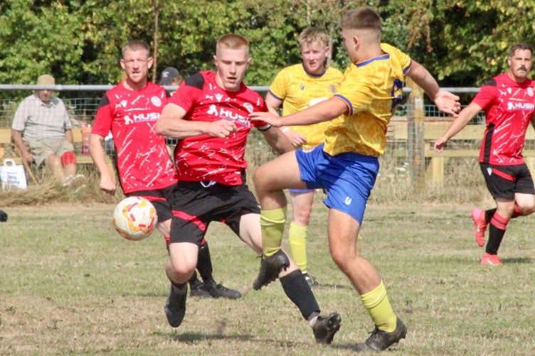Nathan Price in red scored a stoppage time penalty to earn a midweek draw for Mardy at home to Ponthir. File photo: Stuart Townsend