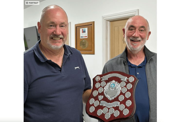 Mark Wells, left, receives the Gilwern Bowls Club men's trophy