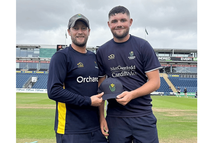 Billy Root presents Abergavenny CC's Tom Norton with his Glamorgan cap