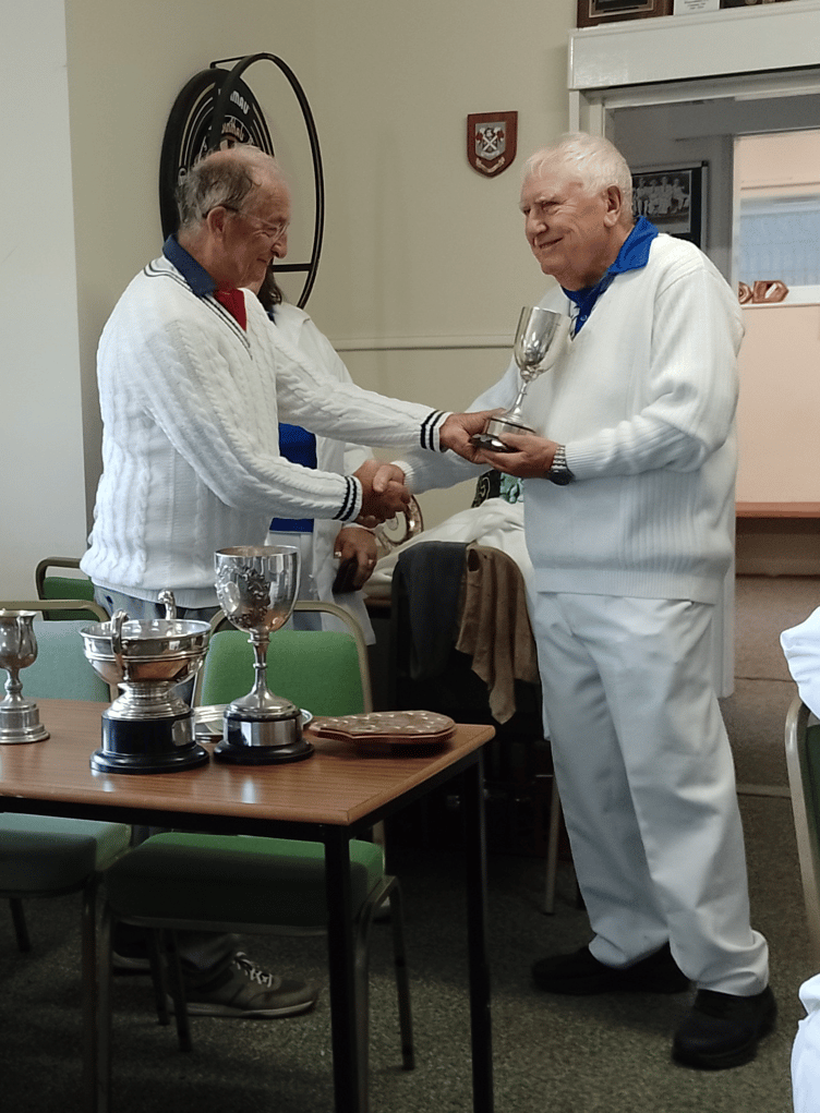 Richard Richards receives the men's pairs cup for the third year running