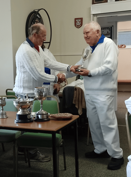 Richard Richards receives the men's pairs cup for the third year running