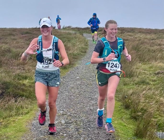Two runners reach the summit in the Waun Fach fell race
