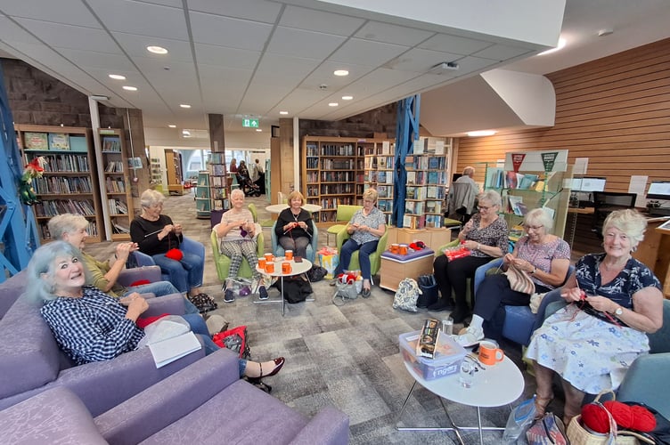 Abergavenny Yarnies working on their poppy display