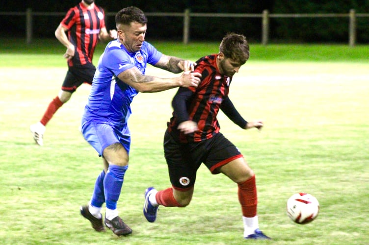 A Goytre player shields the ball in Friday night's 1-0 win