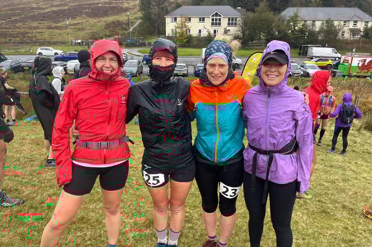 Some of the runners at Storey Arms braced against the elements. Photo: Ellie Salisbury