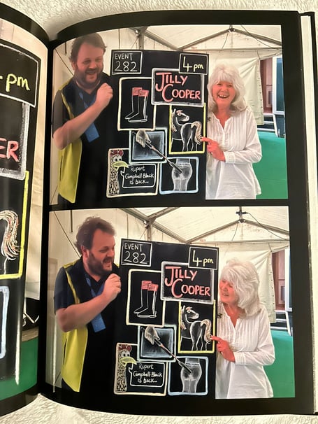 Simon Meredith (left) presents Jilly Cooper with her chalkboard at Hay Festival.