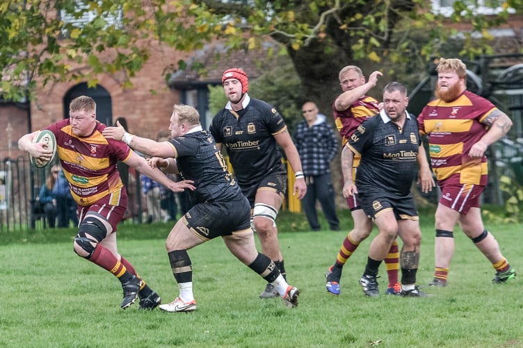 An Aber player tries to escape the Blaina defence's clutches