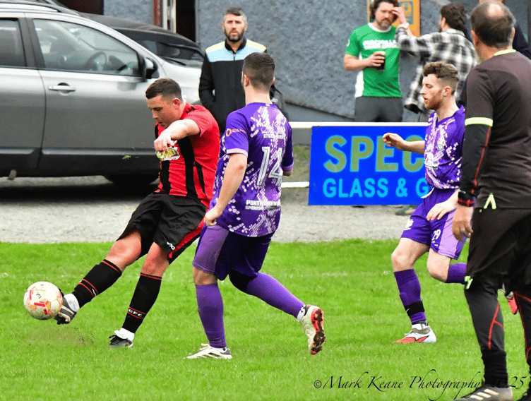 A Crickhowell 2nds player gets a shot away in their 3-0 home win over Pontnewynydd. Photo: Mark Keane Photography