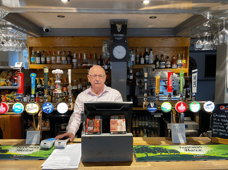 Andrew Powell, owner of The Grofield and The Somerset Arms in Abergavenny, poses behind the bar of the former.