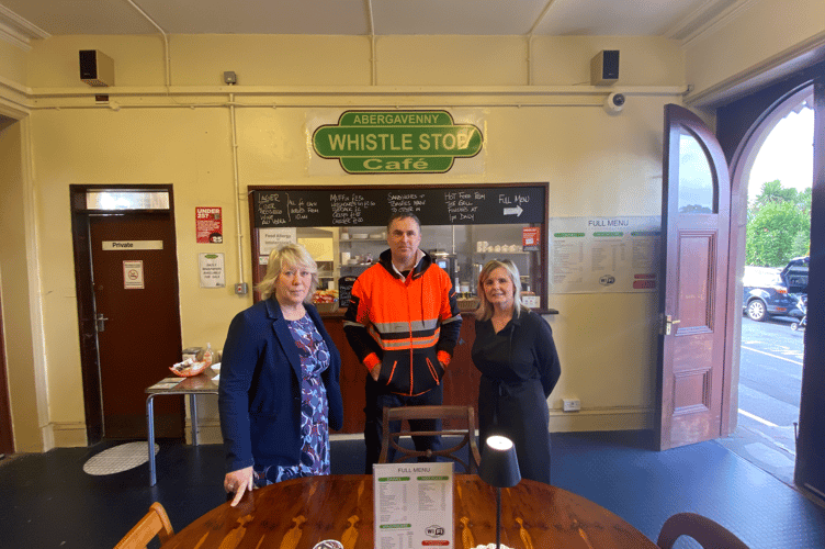 Members of Home Makers charity and Whistle Stop Cafe and in Abergavenny pose for a photo