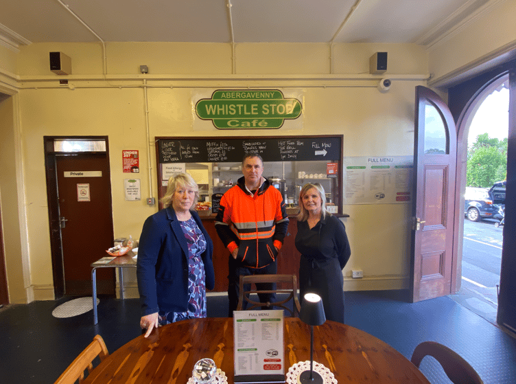 Members of Home Makers charity and Whistle Stop Cafe and in Abergavenny pose for a photo