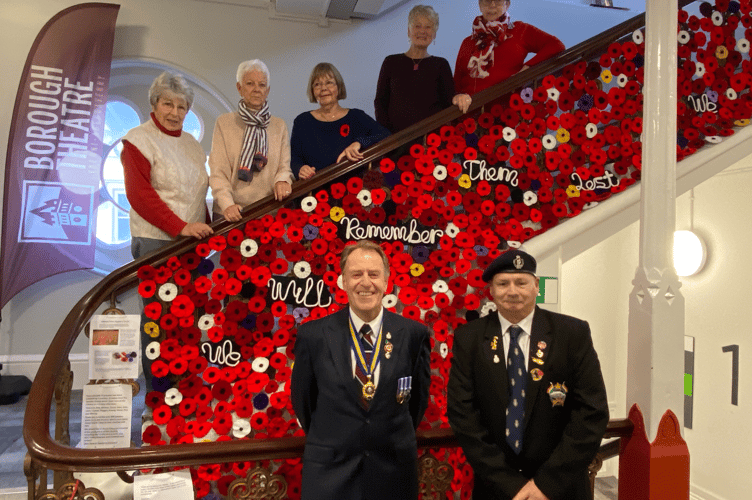Members of the Abergavenny Yarnies Group are joined by reps of the town's RBL branch to unveil their remembrance display
