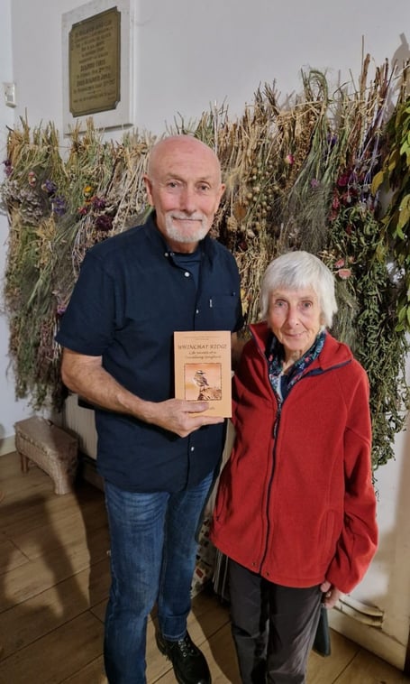 Steve Smith with a copy of ‘Whinchat Ridge’ at his book launch with Dr Stephanie Tyler.