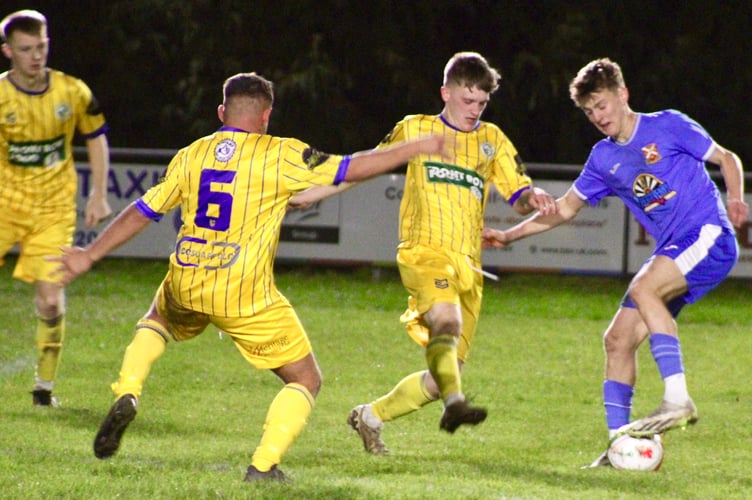 Blaenavon players try to crowd out a Pennies attacker