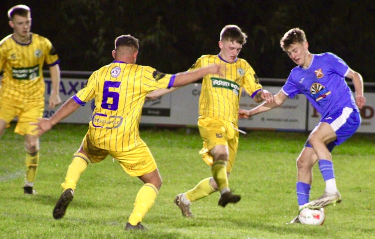 Blaenavon players try to crowd out a Pennies attacker