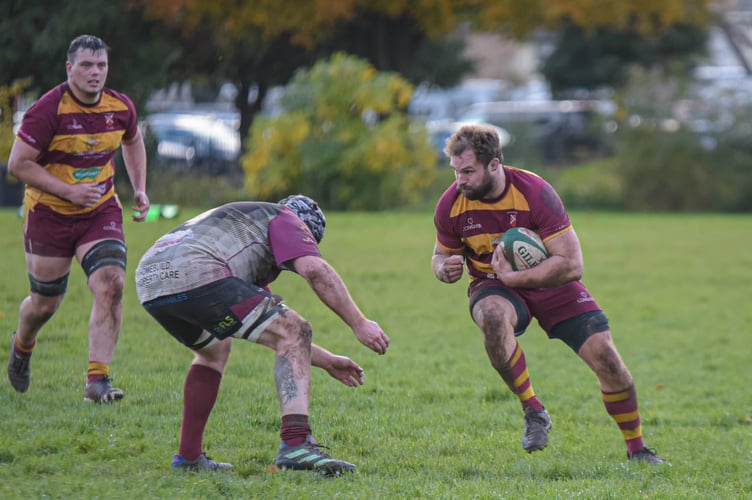 An Aber player braces for contact