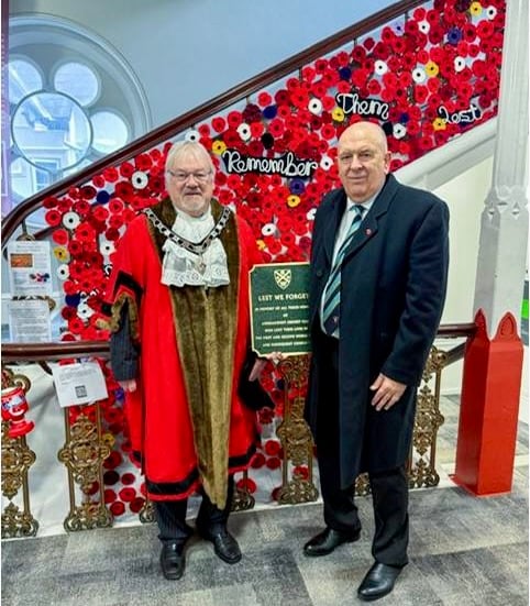Nick Kinman with the plaque alongside the Mayor of Abergavenny, Councillor Philip Bowyer