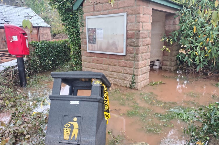 The bus shelter shows the level of the water