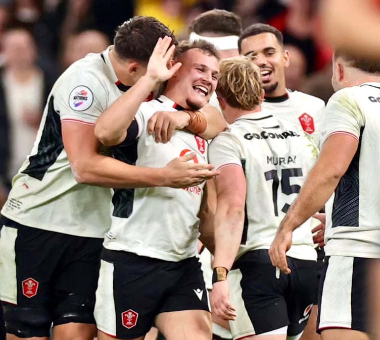 Jarrod Evans is mobbed after his last-gasp winning kick