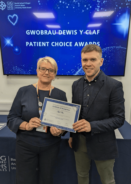 Kyle Price, Abergavenny Pharmacist, picking up his Patient Choice Award 2025