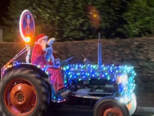 WATCH: As a trail of twinkling tractors lights up a December evening! 