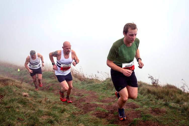 Runners come out of the mist in the Skirrid fell race
