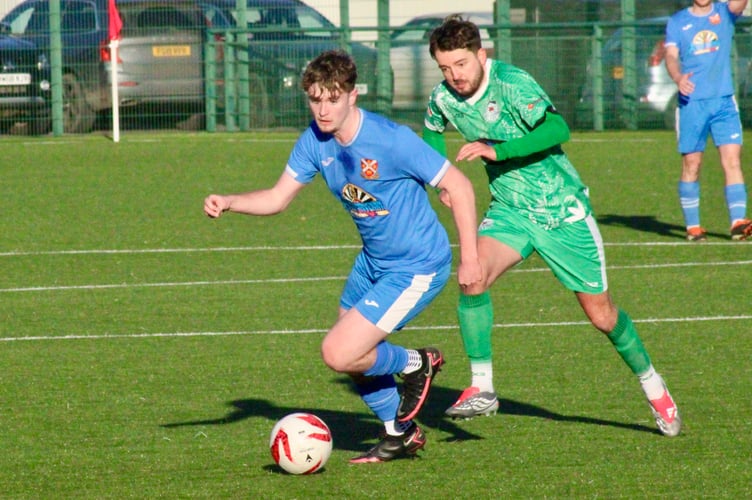 An Aber player tries to break away