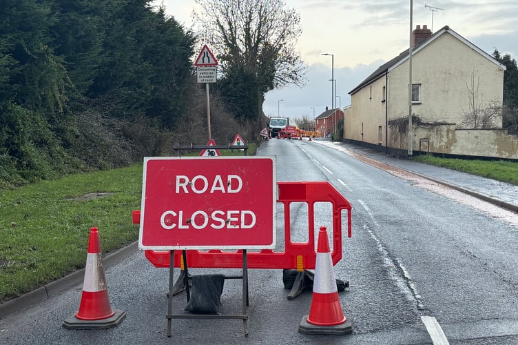 Road closure signs are in place.  AQ 2363
