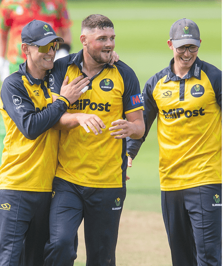 Tom Norton celebrates after taking a wicket in his competitive debut for Glamorgan
