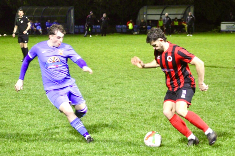 A Goytre player looks to beat his man