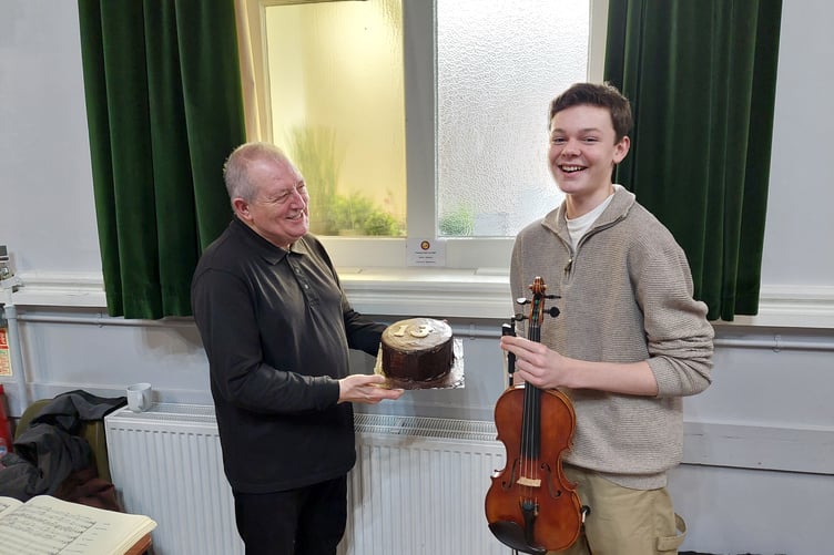 Elis Dickenson celebrates his 13th birthday with musical director Michael Bell