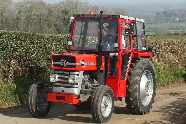 Edward Godsall with his cabbed MF 135