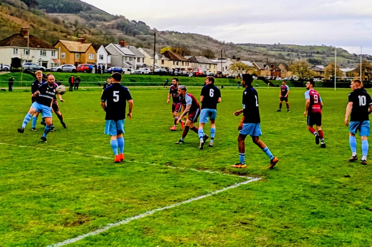 Mardy's Scott Watson clears a Cwmcarn attack