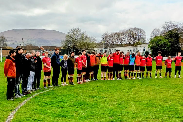 Mardy 2nds lined up for a minute's silence in honour of club stalwart Chris Wham
