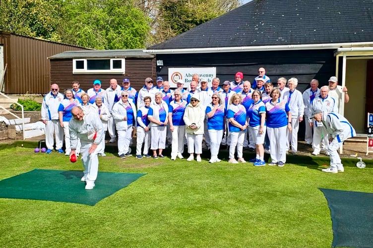 Abergavenny Bowls Club president Robert Poynter delivers the first bowl of the new season.