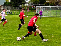 Evans above as high-flying Glo pip 10-man Mardy