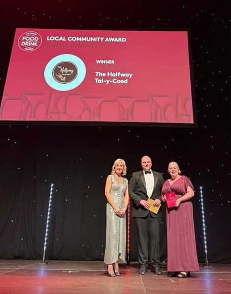 Sian Lloyd presenting the award with Marks & Spencers buyer Gruffudd Roberts 