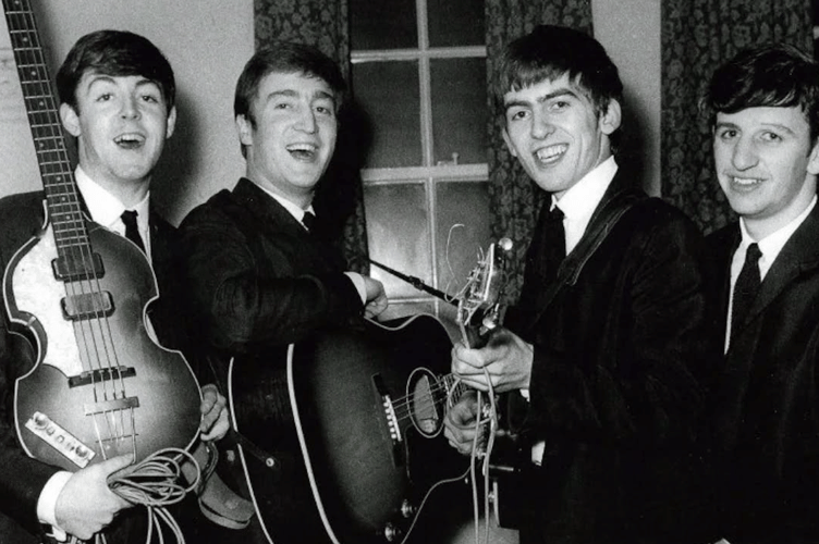 Paul McCartney holding the 'Lost Bass" with The Beatles in the early 1960s. 