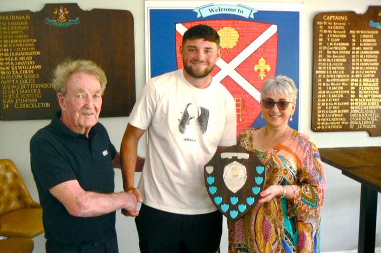 New Glamorgan star Tom Norton is presented with the Ron Collett Shield for Abergavenny CC's Outstanding Achiever of 2025 by Ron's daughter Sara and close friend Mike Powell.