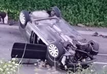 Car overturned after hitting an electricity pole on Hereford Road