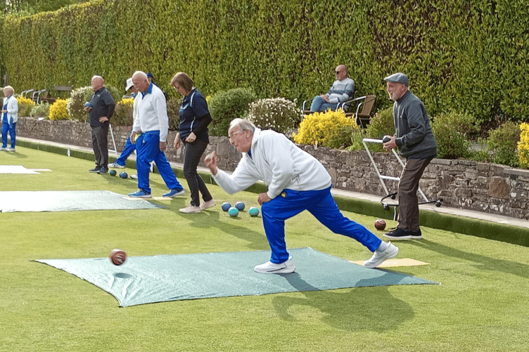 An Abergavenny bowler plays his shot